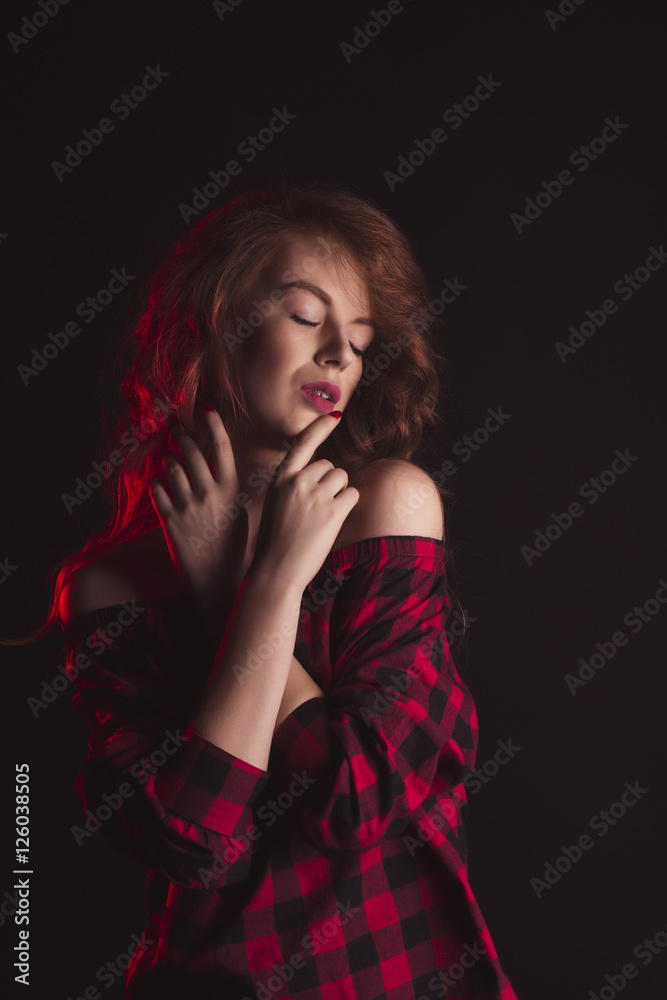 Sensual woman with shadow on her face and red light Sensual woman with shadow on her face and red light