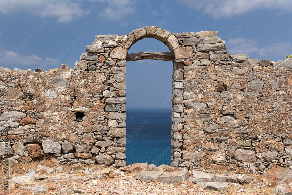 Old antique ruin on a shore of blue sea, Europe, Greece, Crete