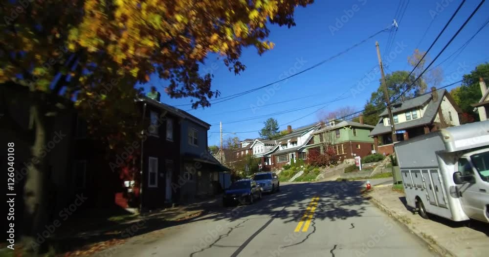 Driving past typical Pittsburgh homes in a residential suburban neighborhood. Driving past typical Pittsburgh homes in a residential suburban neighborhood.