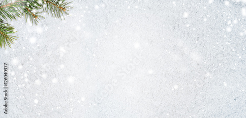 christmas card or new year background made of glittering snowflakes with fir-tree branches