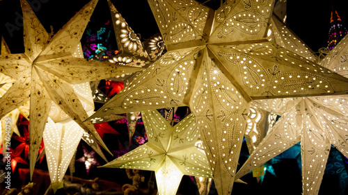 Colorful Christmas stars. A background of star lanterns