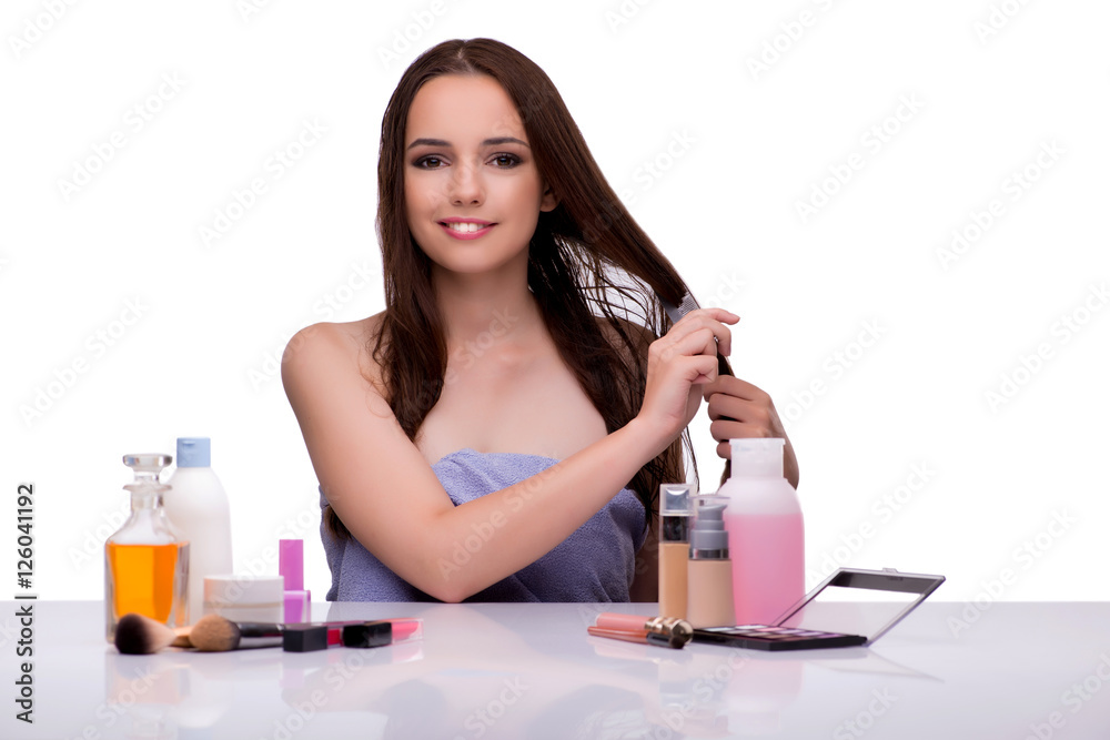 Woman applying make-up isolated on white Woman applying make-up isolated on white
