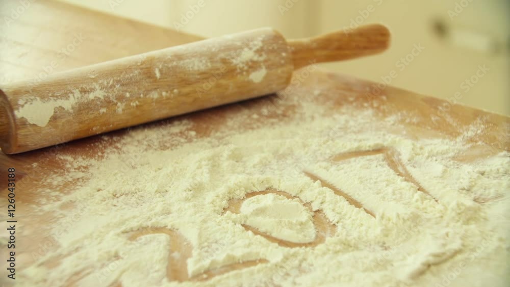 writes 2017. Rolling dough with rolling pin. Chef hands rolling dough ball with dough roller. Baking bread. Men hands rolling dough. Process of forming dough. Woman prepares dough for homemade baking writes 2017. Rolling dough with rolling pin. Chef hands rolling dough ball with dough roller. Baking bread. Men hands rolling dough. Process of forming dough. Woman prepares dough for homemade baking