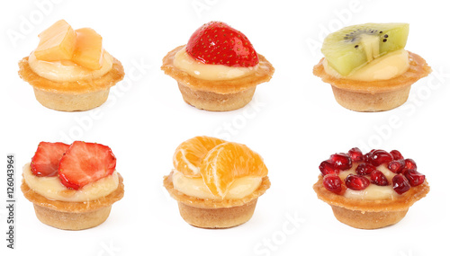 pastry tartlets with fresh fruit isolated on white background
