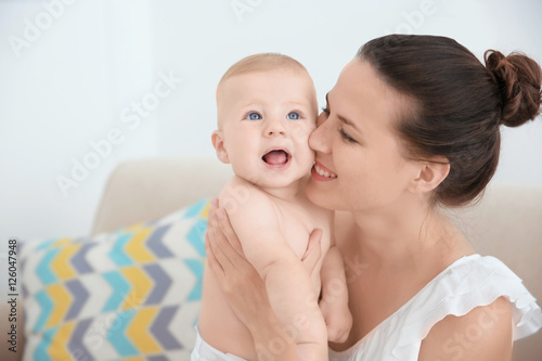 Mother holding little baby ...
