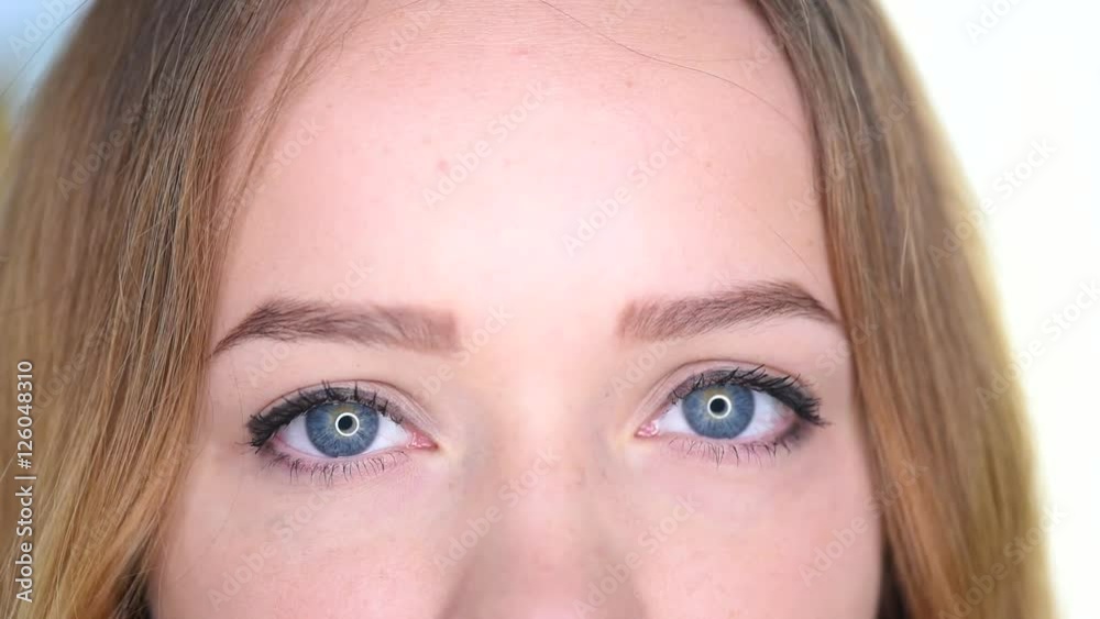 Girl's eyes closeup. Beautiful girl looking at camera close up. Full HD 1080p video footage Girl's eyes closeup. Beautiful girl looking at camera close up. Full HD 1080p video footage