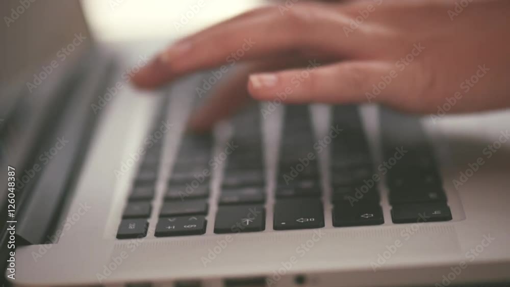 Young woman's hand holding credit card and using laptop for online shopping. E-shopping. Full HD 1080p Young woman's hand holding credit card and using laptop for online shopping. E-shopping. Full HD 1080p
