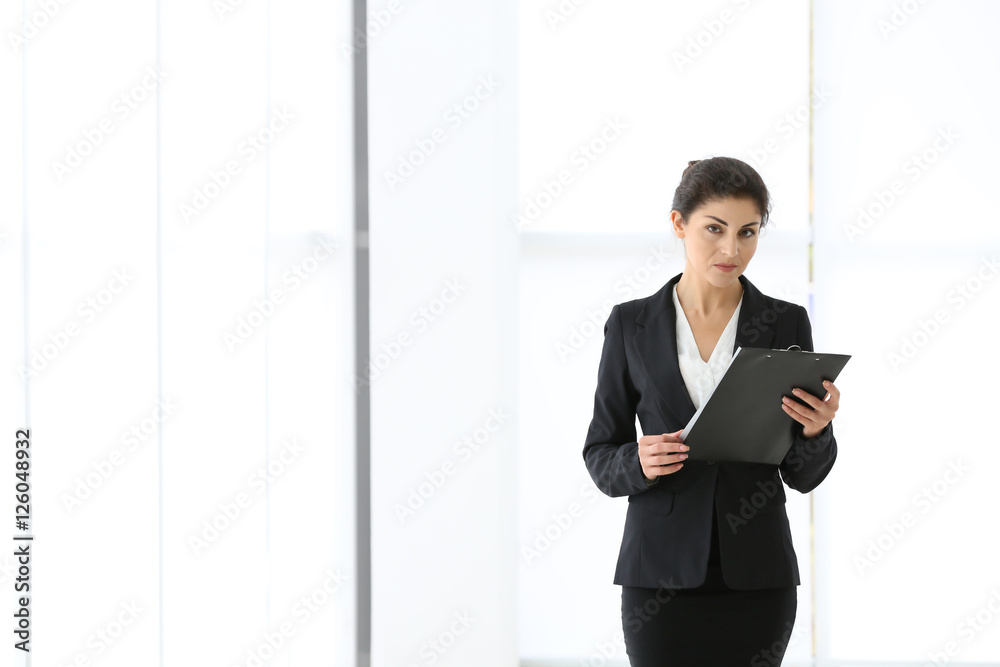 Successful mature businesswoman on light background