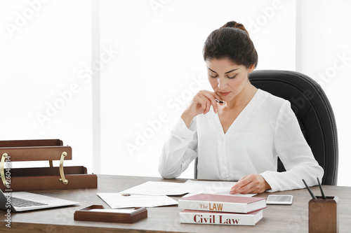 Female lawyer working with ...