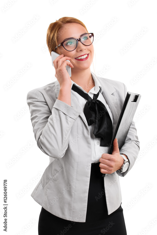 Businesswoman talking on the phone holding a notepad