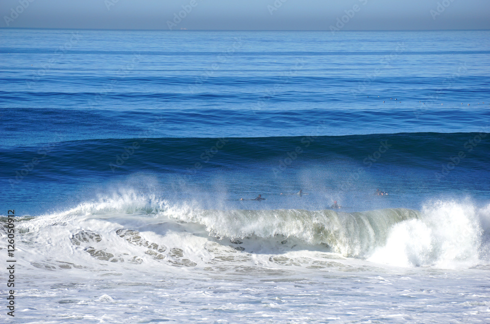 surfers in pacific ocean waiting for waves surfers in pacific ocean waiting for waves