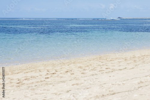 beautiful beach with clear blue skies and blue sea