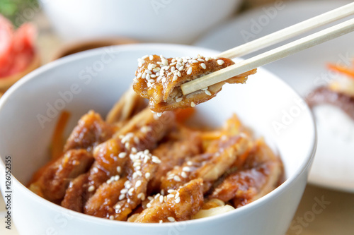 japanese food chicken katsu don served in white bowl with chopst photo