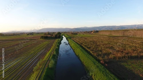 Aerial shot, fly over marshy landscape with autumn colors in europe,  made with drone photo