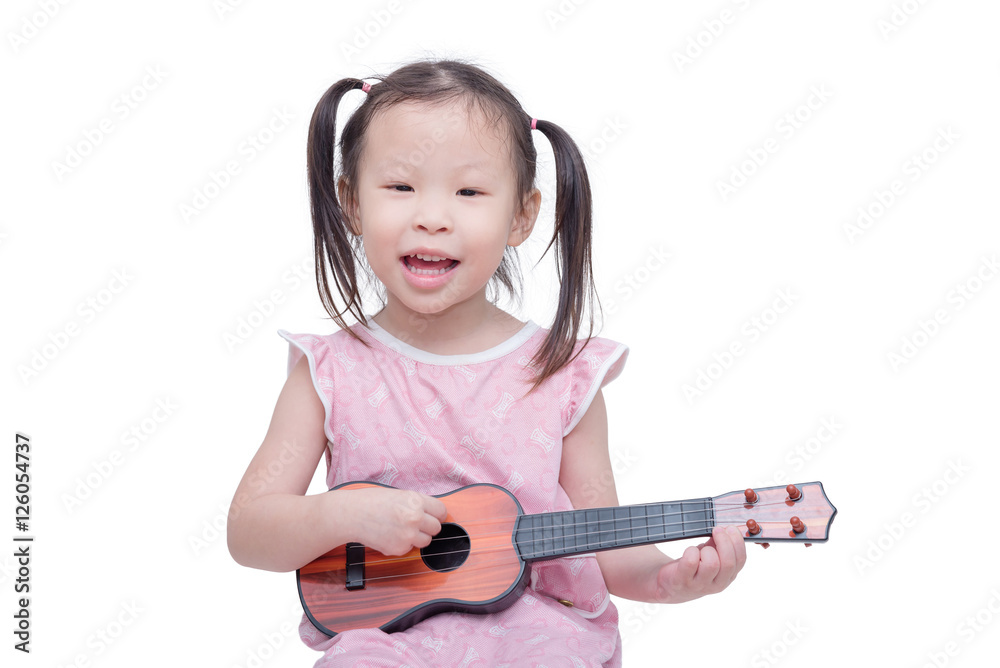 Little asian girl playing guitar toy over white Little asian girl playing guitar toy over white