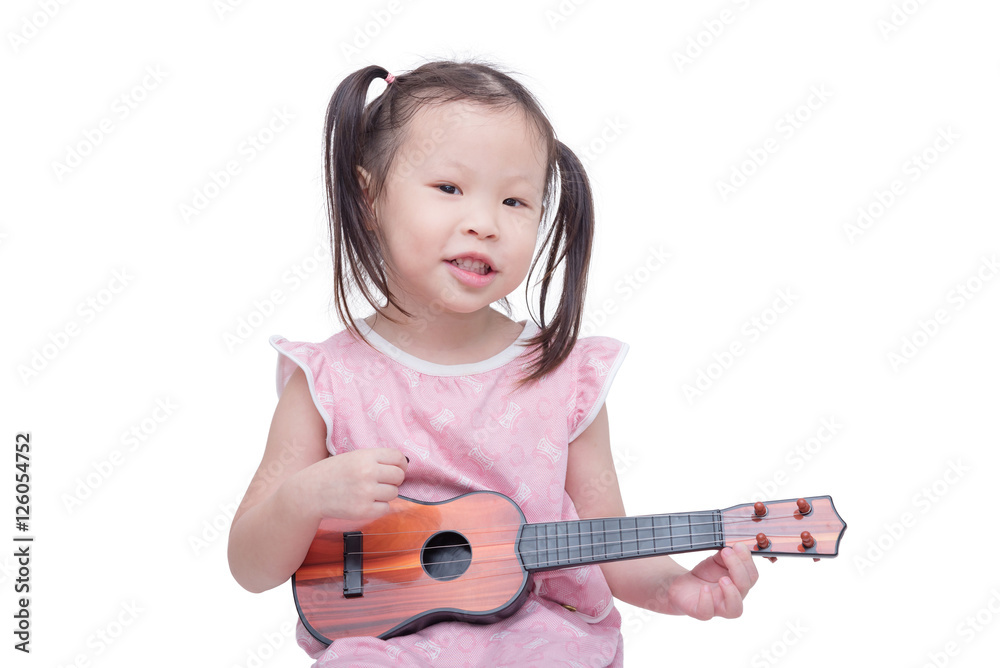 Little asian girl playing guitar toy over white Little asian girl playing guitar toy over white