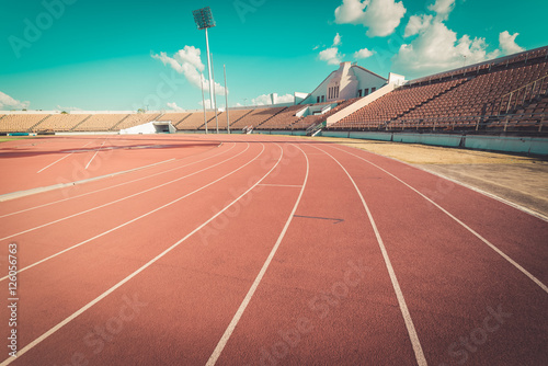 Red running track in stadium , vintage