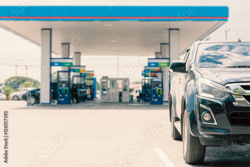 Car parked in a gas station in Thailand.