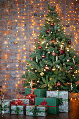 Colorful gifts and presents under a beautiful christmas tree