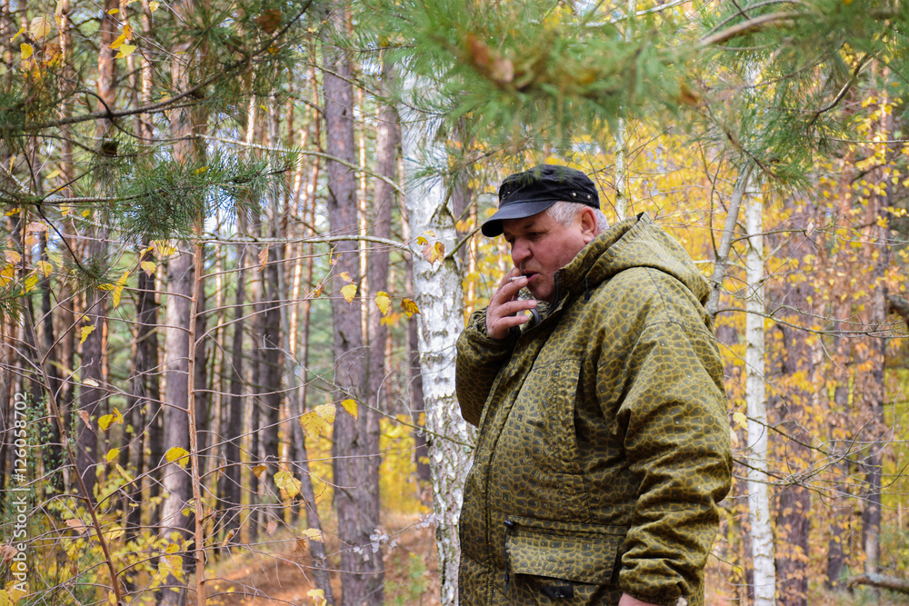 Mature caucasian man in the autumn forest