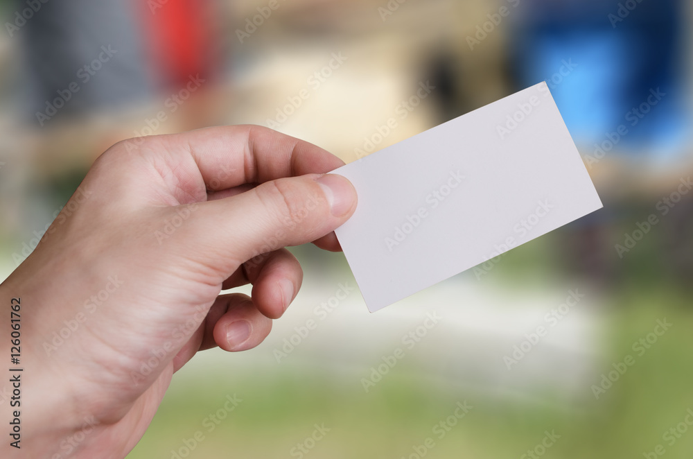 Hand holding a white business card mockup Hand holding a white business card mockup