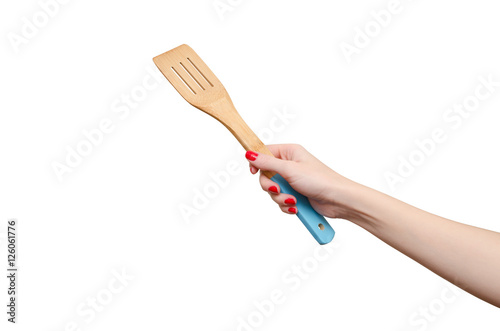 Kitchen spatula in woman's hand