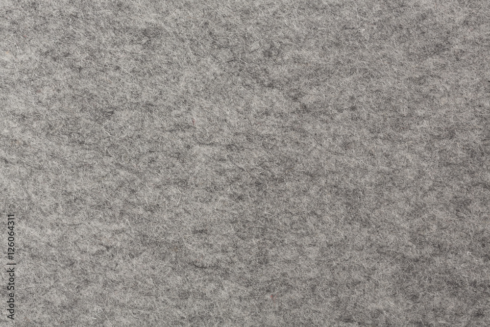 Fototapeta premium Natural gray felt abstract background.