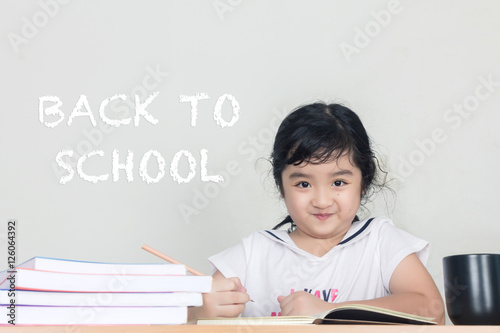Back to school. Schoolchild in class. School kid in classroom. 