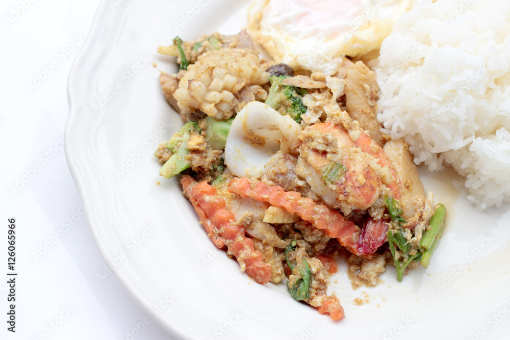 Stir-fried Soft-shelled seafood in curry powder & Thai jasmine rice Stir-fried Soft-shelled seafood in curry powder & Thai jasmine rice