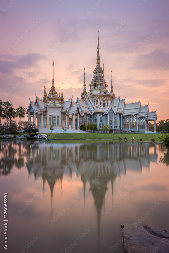 Wat Luang Pho Toh temple with water reflection in twilight time,