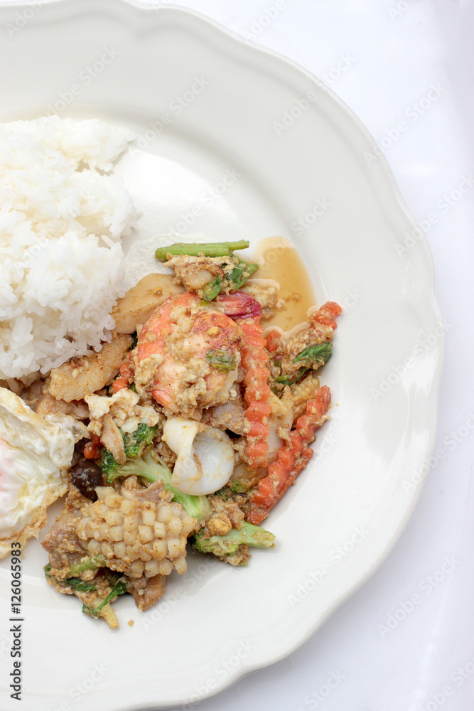 Stir-fried Soft-shelled seafood in curry powder & Thai jasmine rice Stir-fried Soft-shelled seafood in curry powder & Thai jasmine rice