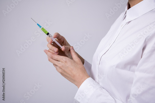 injector held by woman hand