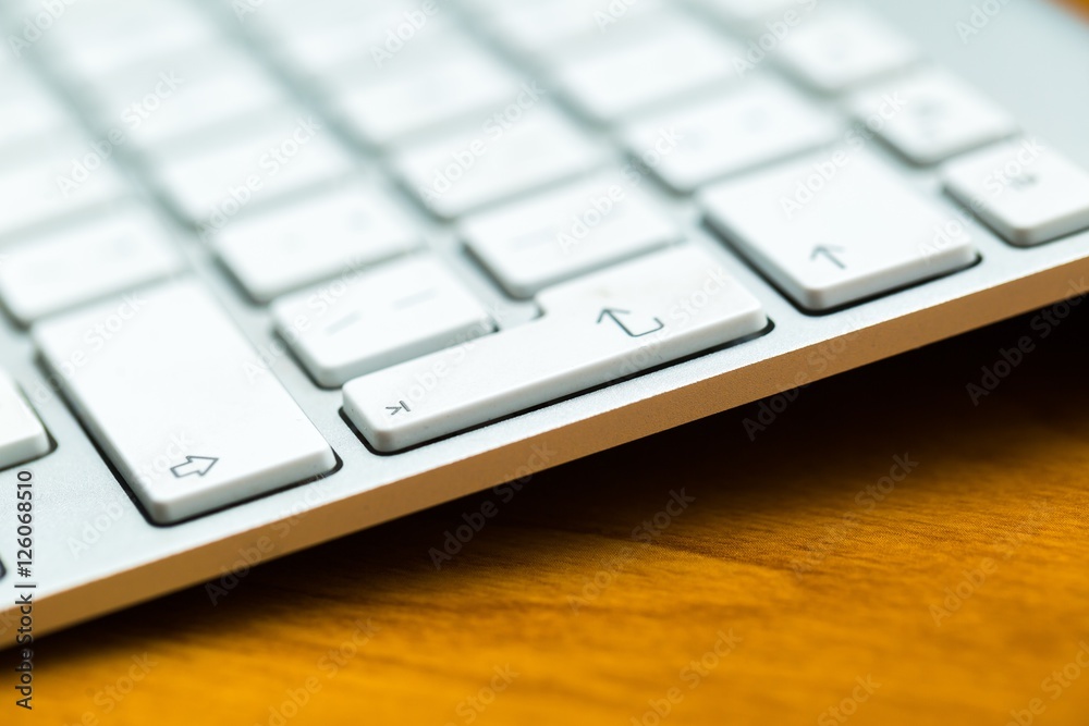 Close up of white wireless aluminum keyboard Close up of white wireless aluminum keyboard