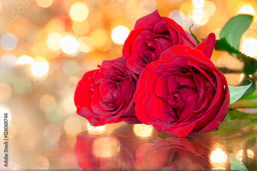 Beautiful red roses on a table. 