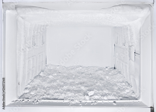 white freezer refrigerator is opened