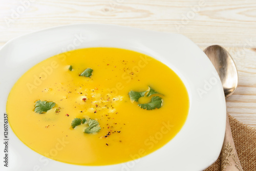 Carrot soup with feta cheese and coriander.