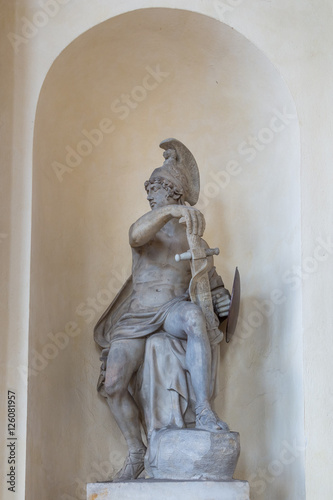 Historic sculpture of ancient greek soldier within Brandenburg Gate in Berlin, Germany.