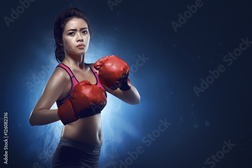 Asian female boxer athlete ready for fight