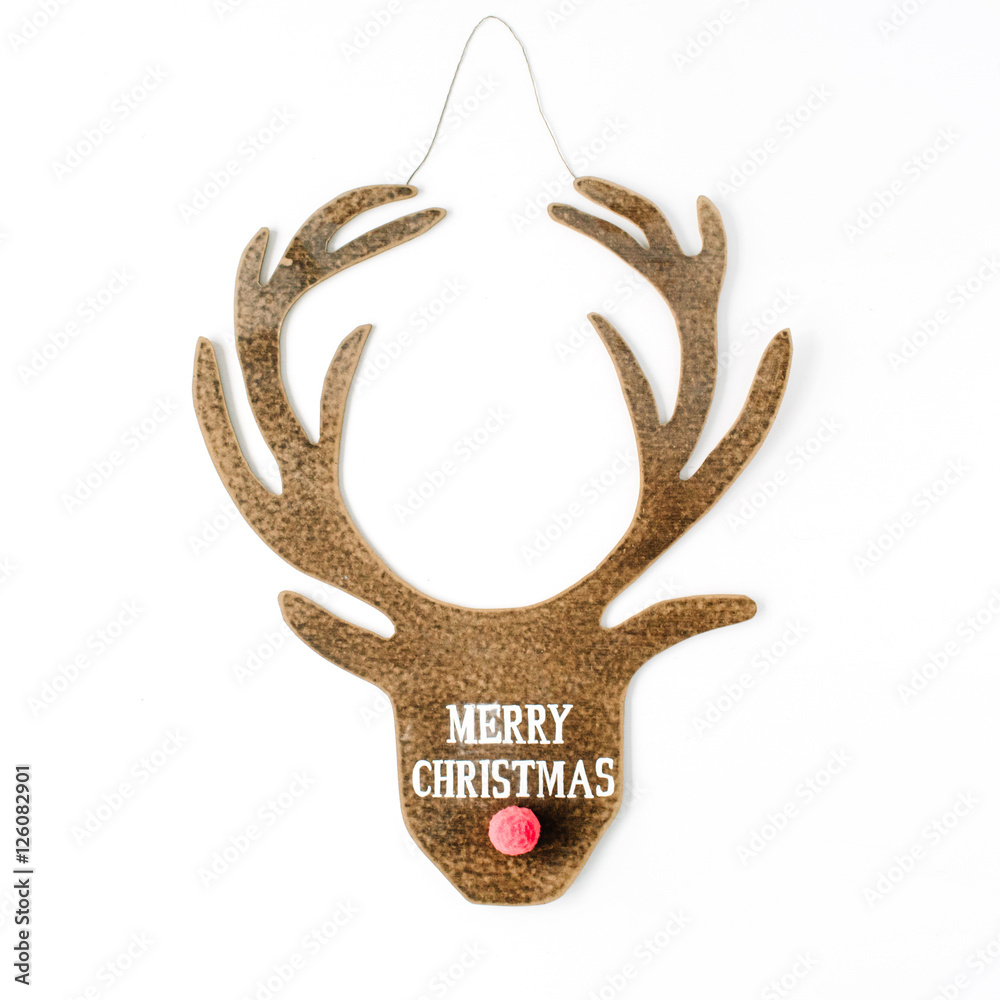 Obraz premium words merry christmas and toy head of christmas deer on white background. flat lay, top view