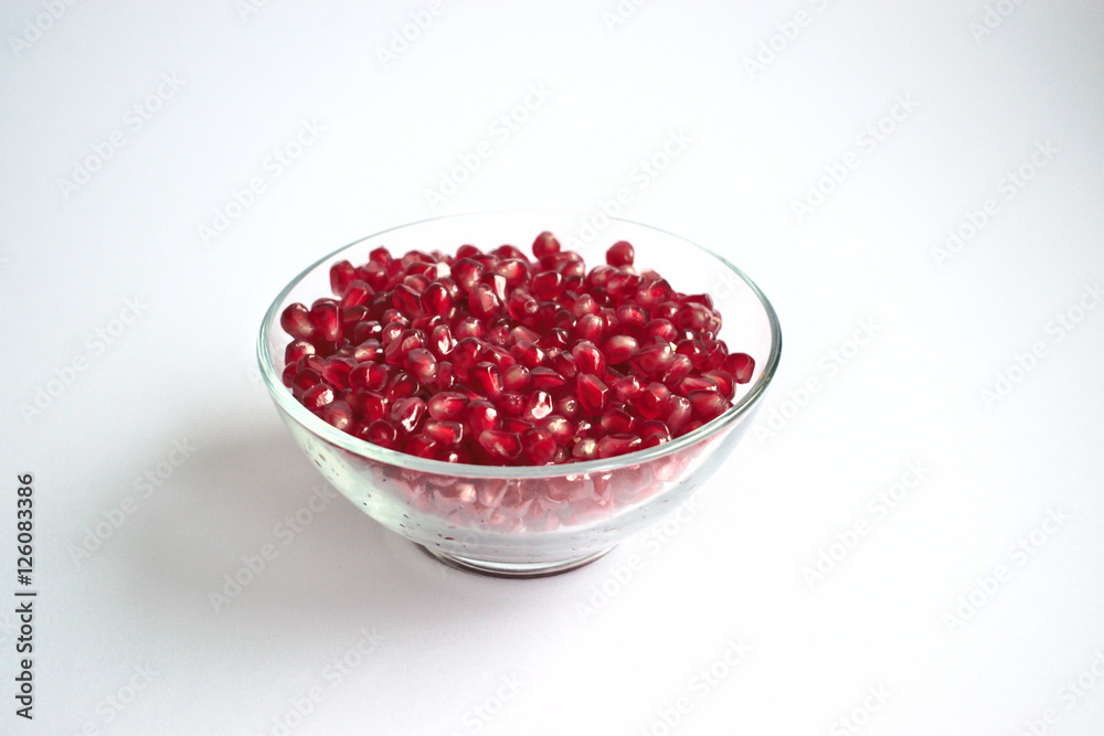 Pomegranate seeds in a clear bowl Pomegranate seeds in a clear bowl