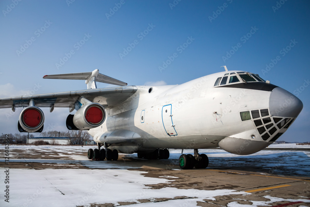 Obraz premium Close-up view of wide body cargo airplane in a cold winter airport