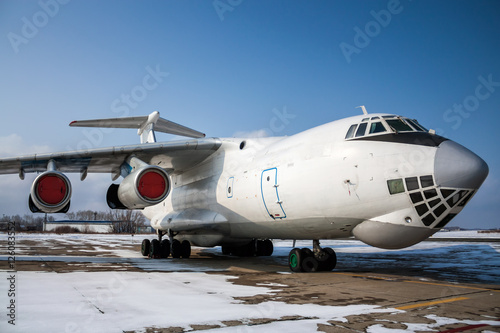 Close-up view of wide body cargo airplane in a cold winter airport