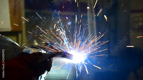 Sparks from welding. burning welding arc welding holder.