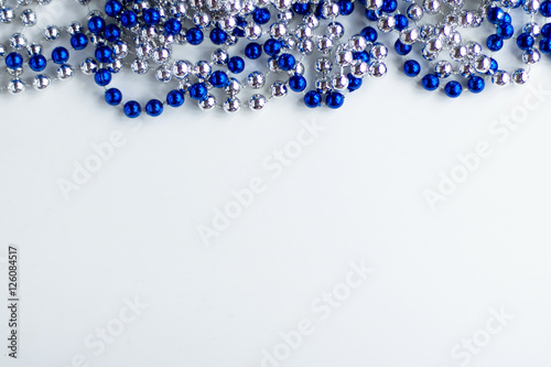 blue and metallic beads on a white background decoration Christmas and new year