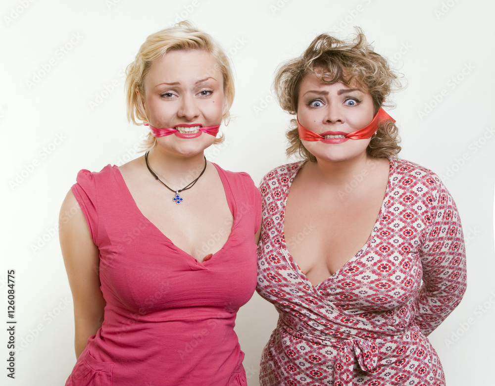two adult fat women hostages tied up with the mouth Stock Photo.