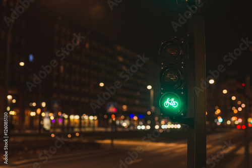 Green traffic lights for bicycles drivers in the evening city