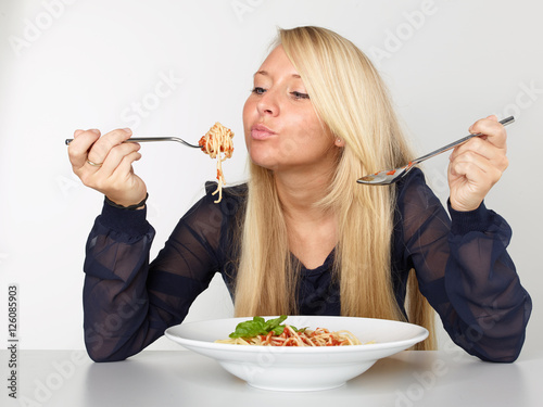 Woman eating spaghetti