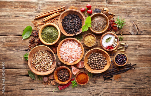 Spices and herbs on a wooden background