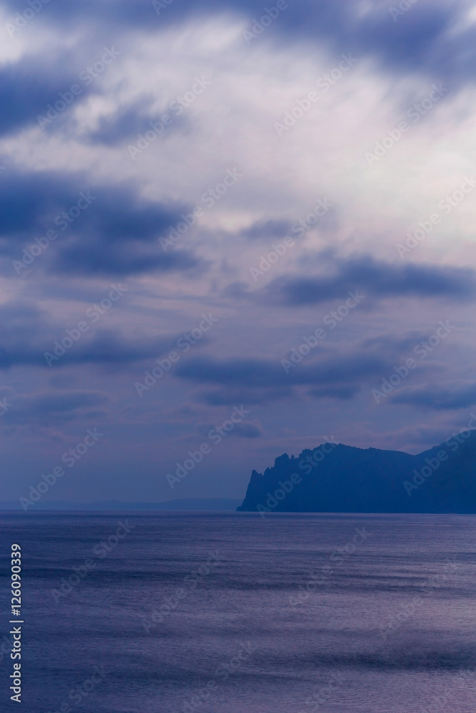 seascape with cliffs in the late evening