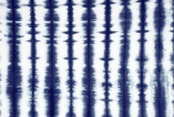 striped tie dye pattern on cotton fabric abstract background.
